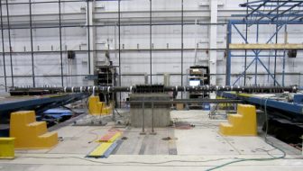 Pipeline specimens were anchored to shake tables to simulate the passage of a seismic wave through two adjacent push-on joints. Experiments took place at a University at Buffalo laboratory.